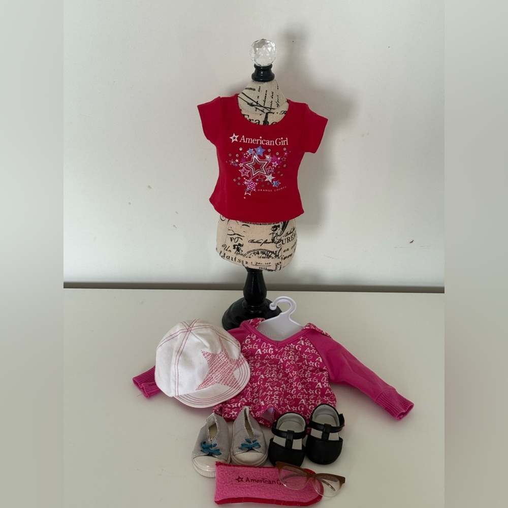 Pack of American Girl doll clothes.